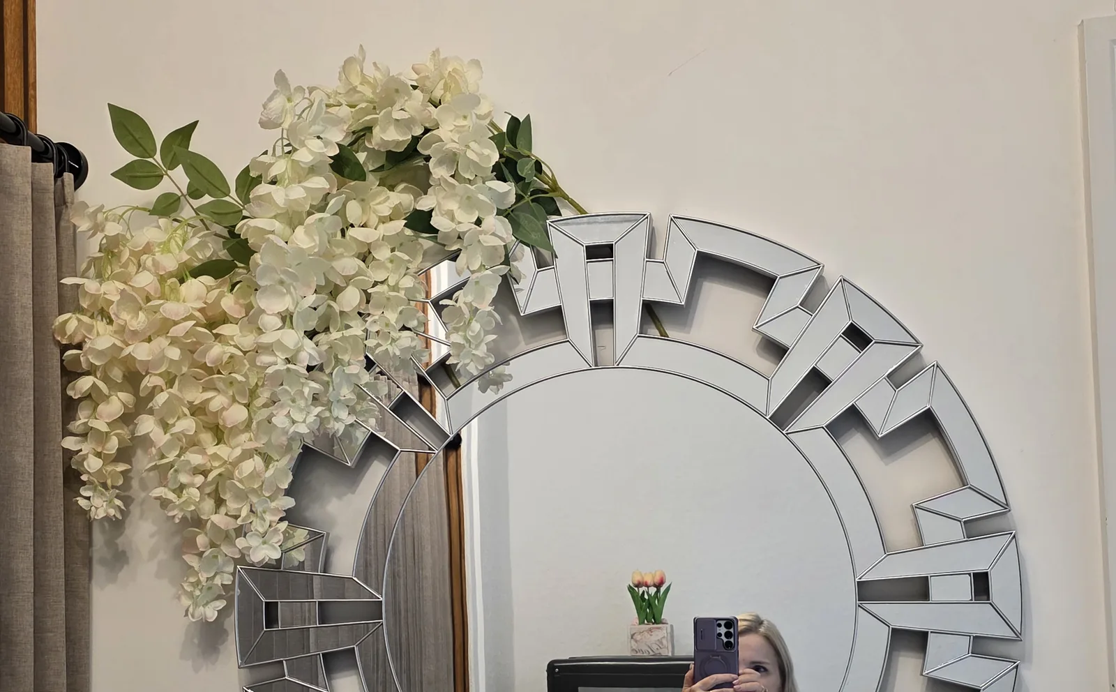 Mirror and flower wall in the salon